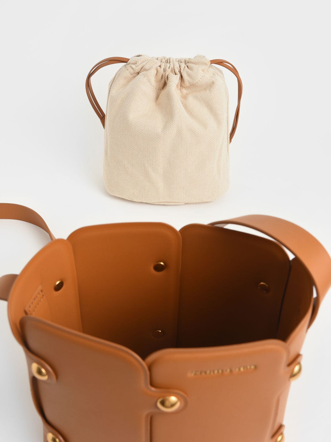 Charles & Keith Studded Drawstring Bucket Bag - Cognac
